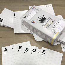 Image of a box that reads "Alphabet Royal" with cards spread out to spell "awesome" - Texas Game Studio